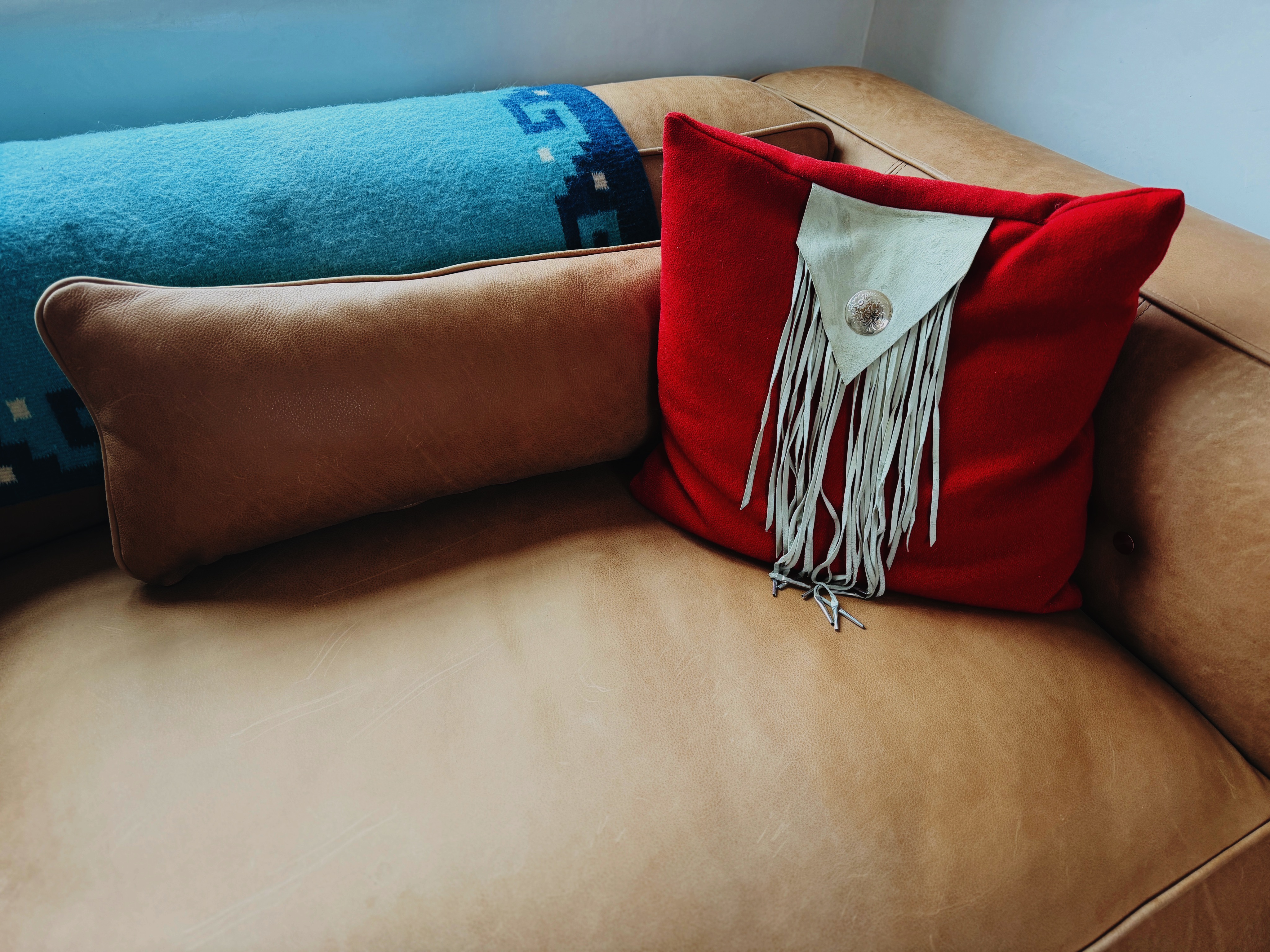 Leather sofa with Southwest pillows
