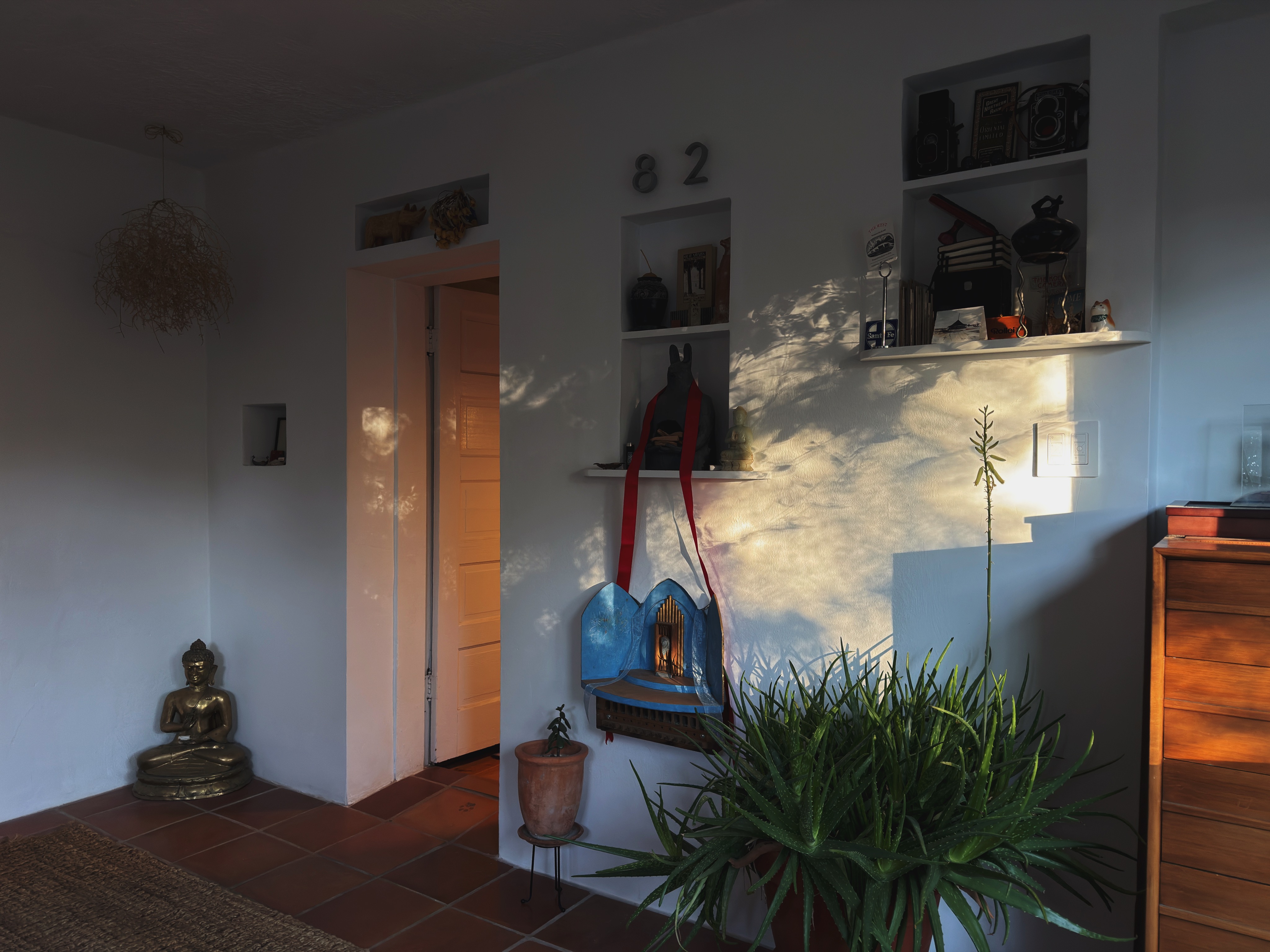 Entryway with Buddha and altar